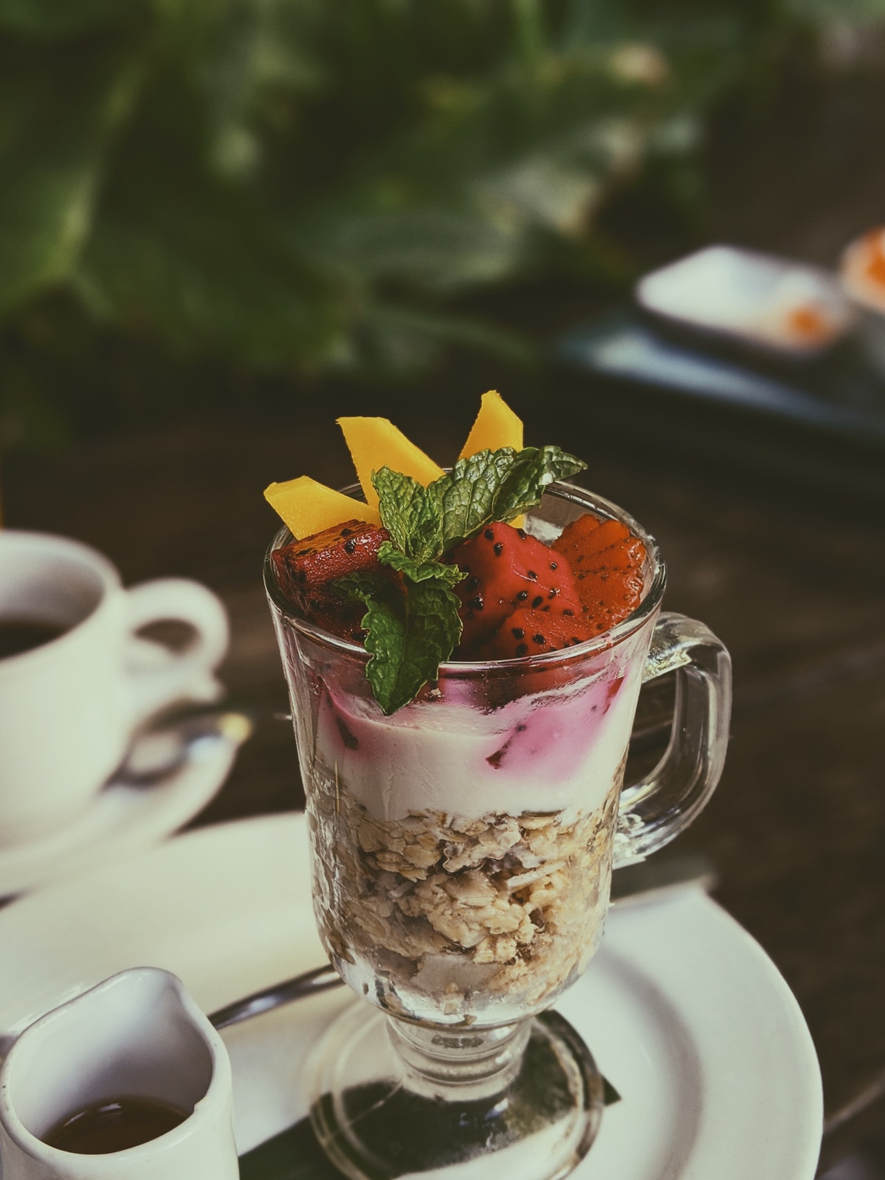 A plate of flapjacks with strawberries and blueberries